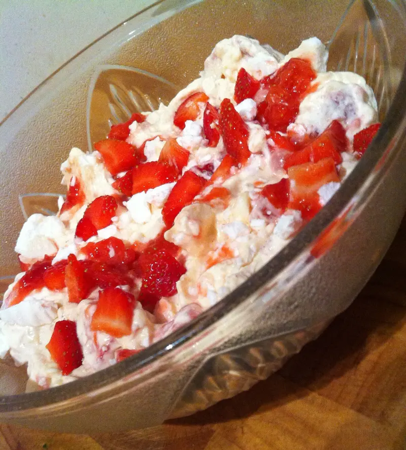 Bowl of Eton mess: crushed meringue folded through whipped cream with chopped fresh strawberries